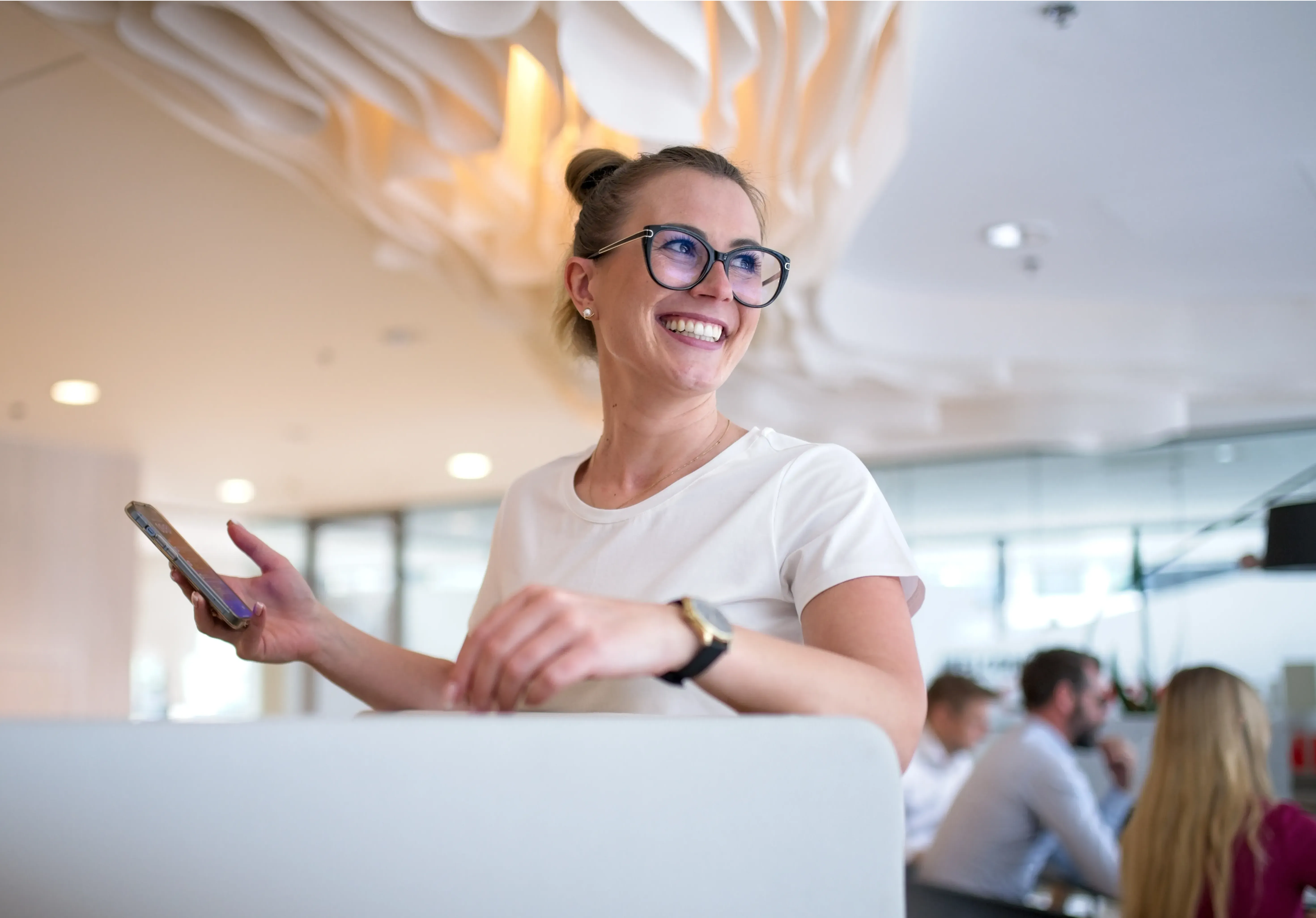 Ola holding a cellphone