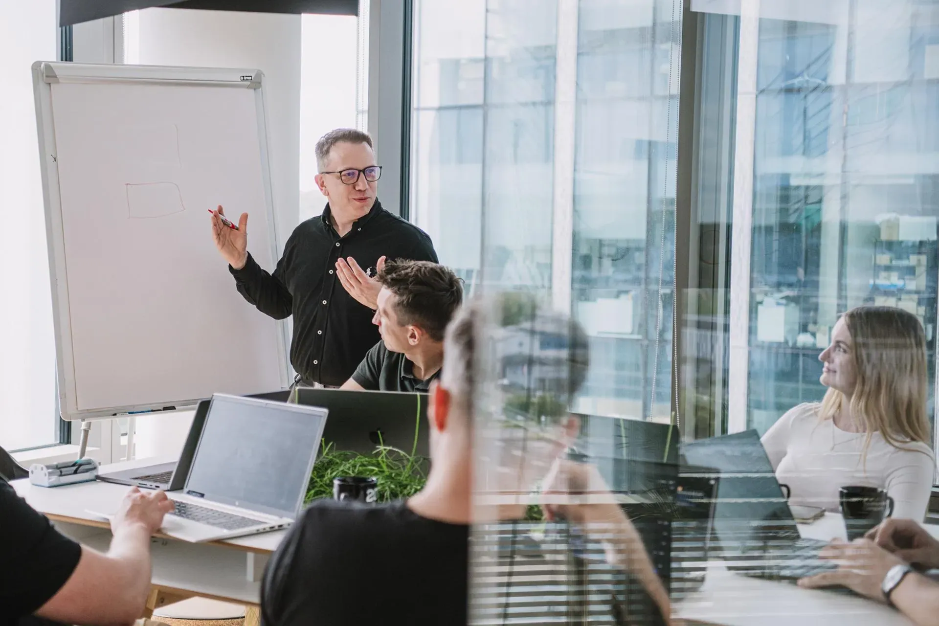 Our developer presents to a group of people in an office.